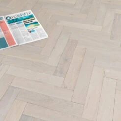 Liberty Floors Ivory White Oak - Herringbone Parquet 14mm Engineered Real Wood Flooring (219387) -Famous Flooring Store ivory white oak herringbone parquet 14mm engineered real wood flooring 219387 p85835 201396 image